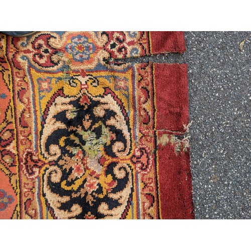 297 - A late 19th century Turkish carpet with repeated motifs, A/F, approx 16' x 13'