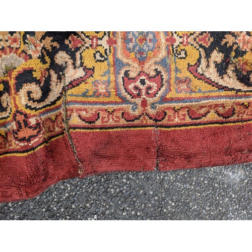 297 - A late 19th century Turkish carpet with repeated motifs, A/F, approx 16' x 13'