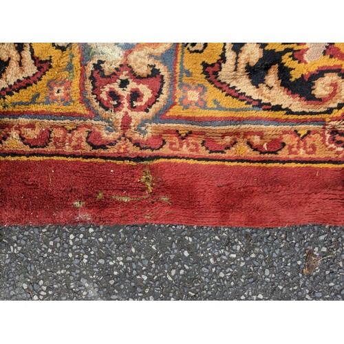 297 - A late 19th century Turkish carpet with repeated motifs, A/F, approx 16' x 13'