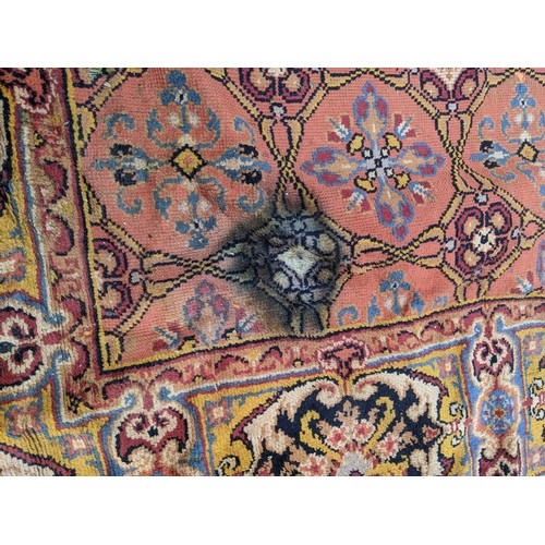 297 - A late 19th century Turkish carpet with repeated motifs, A/F, approx 16' x 13'