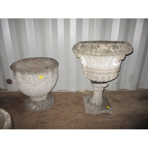 151 - Two weathered concrete garden footed planters