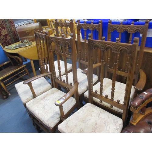 313 - Four Ercol dining chairs and two matching carvers together with an Ercol D-ended and extending dinin... 