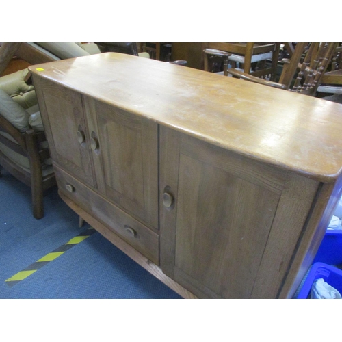 318 - An Ercol sideboard on splayed legs