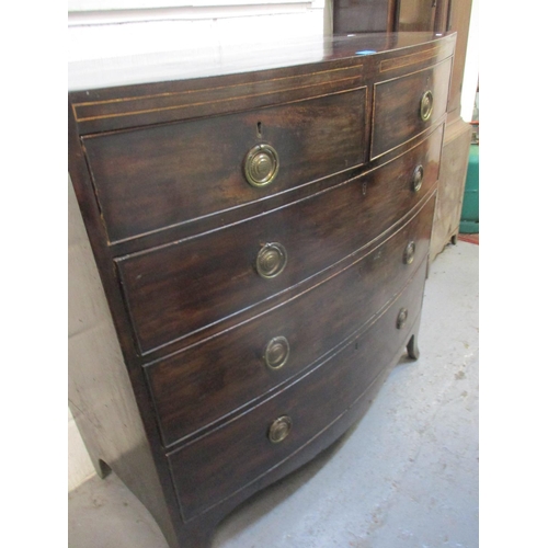 33 - A George III mahogany bowfront chest of two short and three long graduating drawers on splayed legs
... 
