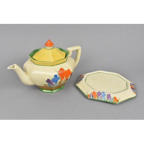 100 - A Clarice Cliff Athens shape teapot in the Autumn Crocus pattern, together with an octagonal base, a... 