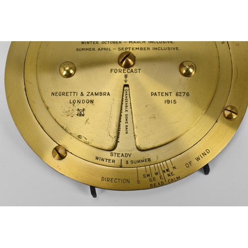 157 - A Negretti & Zambra 1915 Patent brass weather forecaster, of circular form with volvelles, impressed... 