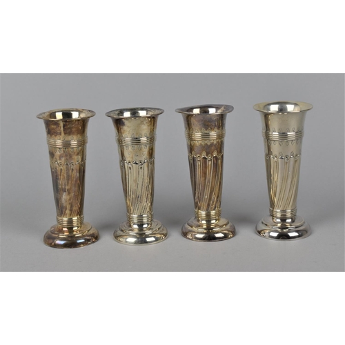 18 - A set of four Edward VII silver posy vases by William Aitken, Birmingham 1905, with everted rims, pa... 