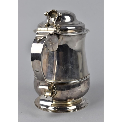 2 - A George II silver lidded tankard by Richard Gurney & Thomas Cook, London 1750, with a hinged, domed... 