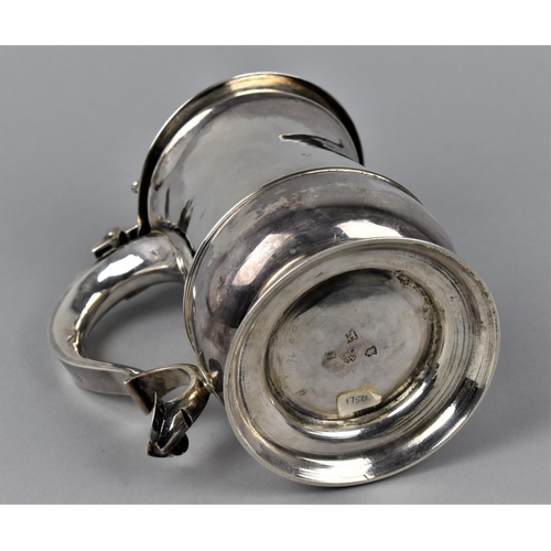 2 - A George II silver lidded tankard by Richard Gurney & Thomas Cook, London 1750, with a hinged, domed... 