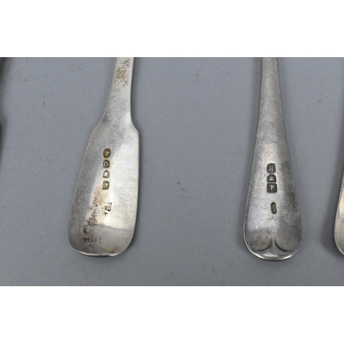 21 - A quantity of silver fiddle pattern flatware to include a pair of George III silver table spoons by ... 