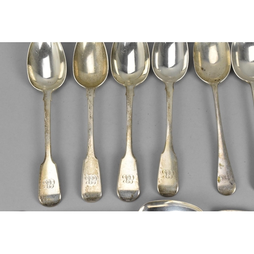 21 - A quantity of silver fiddle pattern flatware to include a pair of George III silver table spoons by ... 