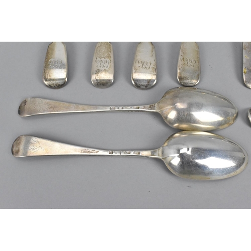 21 - A quantity of silver fiddle pattern flatware to include a pair of George III silver table spoons by ... 