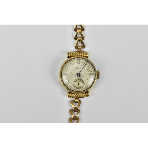 36 - A 9ct gold ladies wristwatch, the face signed 'Philippe', with box clasp, 18 cm long