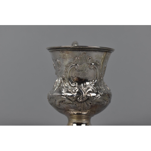 7 - A Victorian silver gilt christening cup by Charles Lias, London 1840, with embossed floral detail th... 