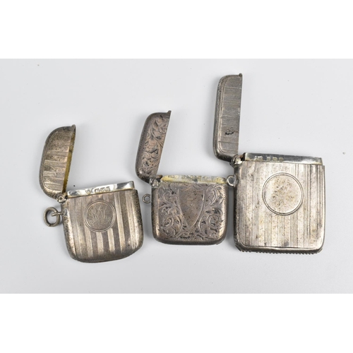 71 - A group of eight silver vesta cases, dates ranging from 1899 to 1925, comprising models with turned ... 