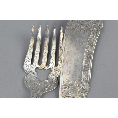 76 - A pair of Victorian silver fish servers by Josiah Williams & Co, Exeter 1854, with etched foliate de... 