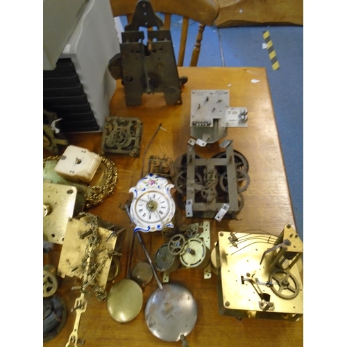 4 - A selection of clock movements and other parts, to include chronometer dials signed Frosham, Ulysse ... 