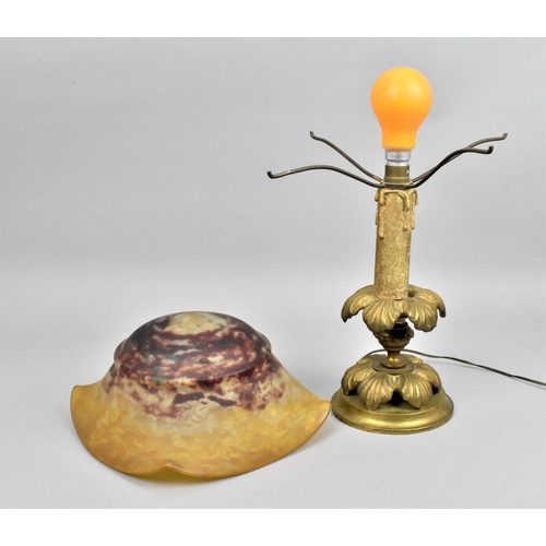 31 - An early 20th century Daum glass mushroom lamp, the mottled red and yellow domed shade with lobbed s... 