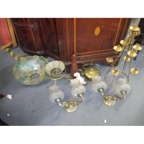 221 - A miscellaneous collection of items to include a pair of brass wall sconces, a gilt metal candlehold... 