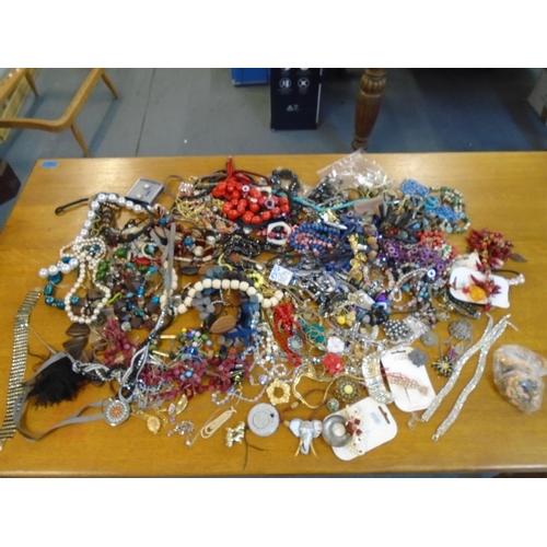 201 - A large selection of fashion costume jewellery to include beaded necklaces, brooches and other items... 