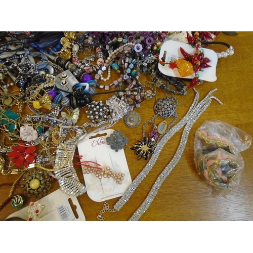 201 - A large selection of fashion costume jewellery to include beaded necklaces, brooches and other items... 