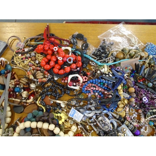 201 - A large selection of fashion costume jewellery to include beaded necklaces, brooches and other items... 