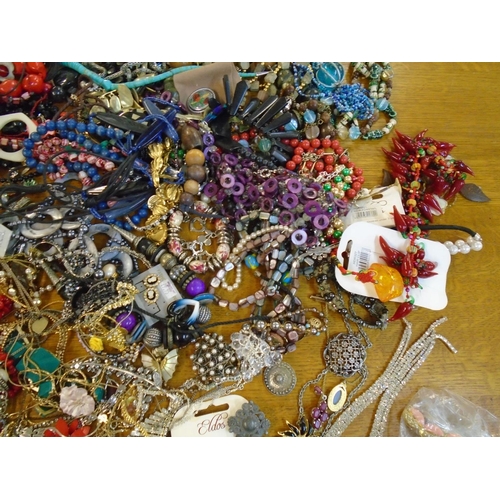 201 - A large selection of fashion costume jewellery to include beaded necklaces, brooches and other items... 