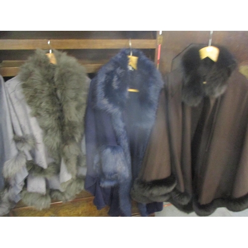 203 - Modern ladies outer garments with faux fur and rabbit fur trims to include a Jayley poncho, one size... 