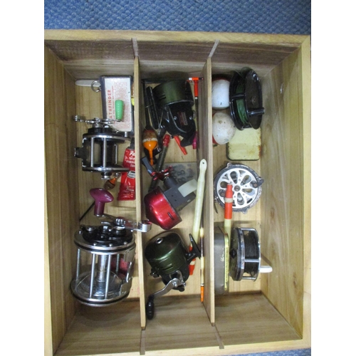 78 - A box containing various fishing reels, floats and other fishing accessories to include an Olympic 4... 