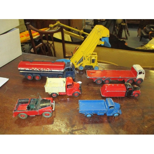 206 - Seven vintage Dinky toys to include a Dinky Foden tanker, an elevator loader, a Foden flat bed truck... 