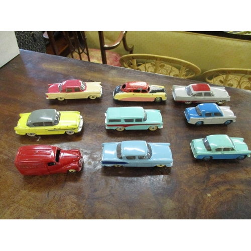 210 - Nine vintage Dinky cars to include a 471 Austin Nestle van, 180 Packard Clipper Sedan, Hudson Sedan,... 