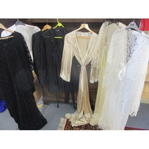 217 - Ladies 20th century evening nightgowns and negligees together with beach over garments and silk robe... 