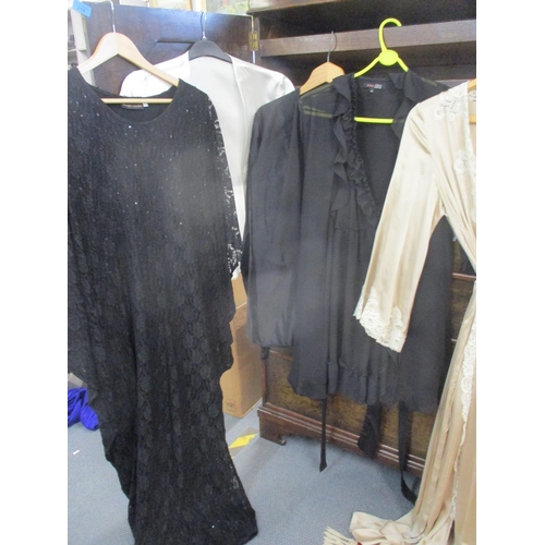 217 - Ladies 20th century evening nightgowns and negligees together with beach over garments and silk robe... 