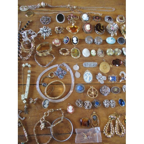 224 - Costume jewellery to include Continental brooches, cameo reproductions, cufflinks, earrings and neck... 