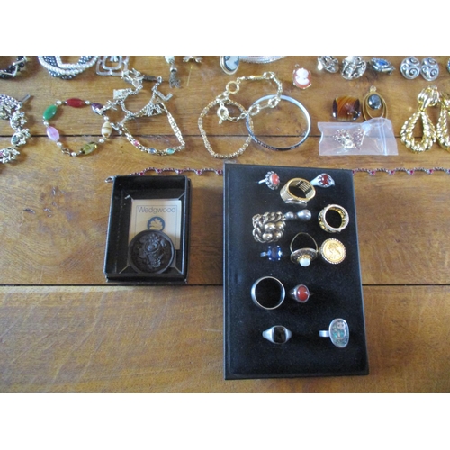 224 - Costume jewellery to include Continental brooches, cameo reproductions, cufflinks, earrings and neck... 