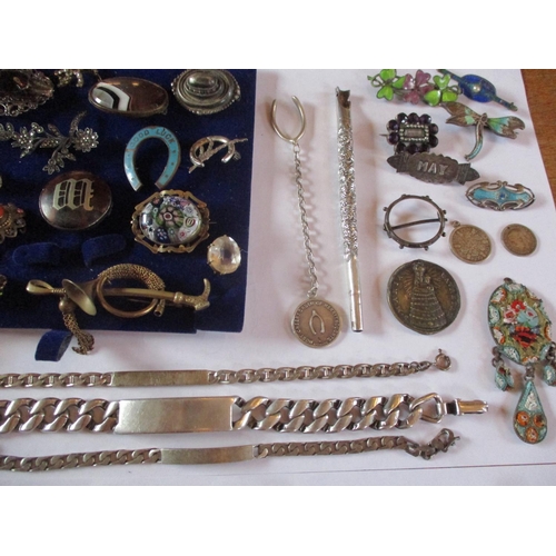 225 - Costume jewellery to include a 19th century mourning brooch, three white metal identity bracelets, f... 