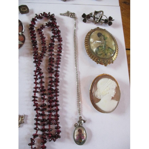 225 - Costume jewellery to include a 19th century mourning brooch, three white metal identity bracelets, f... 