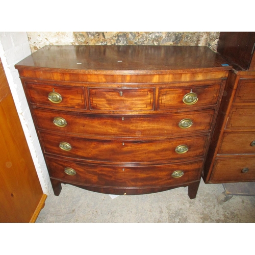 229 - A Georgian mahogany bow front chest of drawers with three short over three long drawers, raised on b... 