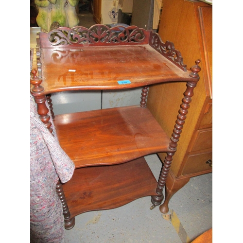 240 - A Victorian mahogany serpentine three-tier whatnot, with pierced gallery top and barley twist suppor... 