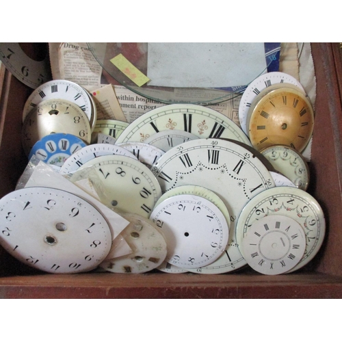 296 - A quantity of clock parts to include brass Grand Father clock dials, other clock dials and twelve co... 