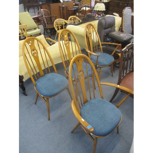 314 - A set of four modern Ercol dining chairs with carved swan backrests to include two carvers
Location:... 