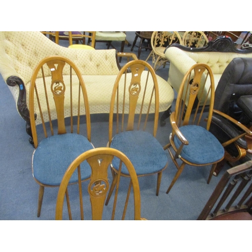 314 - A set of four modern Ercol dining chairs with carved swan backrests to include two carvers
Location:... 