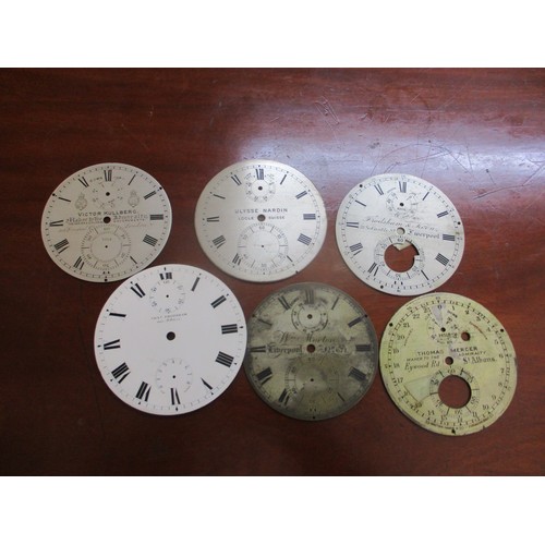 4 - A selection of clock movements and other parts, to include chronometer dials signed Frosham, Ulysse ... 