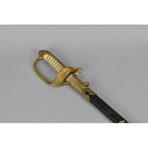 159 - A Japanese WWII Officer's sword (kyu-gunto), with white same grip and brass mounted hilt, with sakur... 