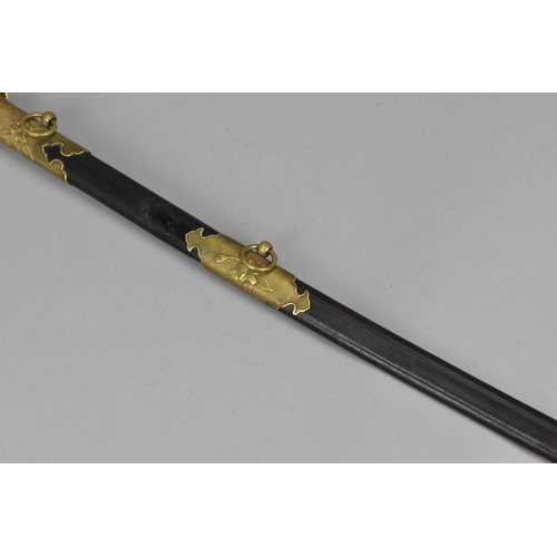 159 - A Japanese WWII Officer's sword (kyu-gunto), with white same grip and brass mounted hilt, with sakur... 