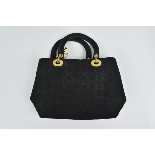 173 - A circa 1990's Christian Dior Lady Dior MM bag in Cannage quilted navy fabric with gold tone hardwar... 