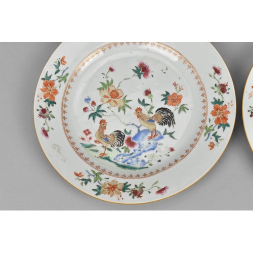 21 - Two Chinese export Famille rose porcelain plates, 18th century, the central roundel depicting two ro... 