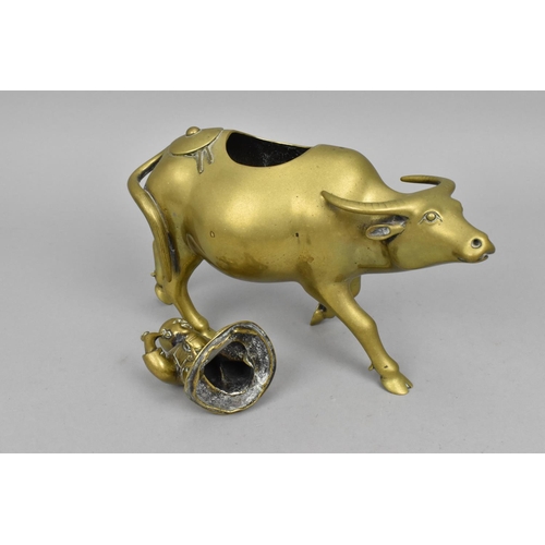 41 - A Chinese turn of the century brass model of a sage on a water buffalo, 22 cm high x 22 cm wide, tog... 