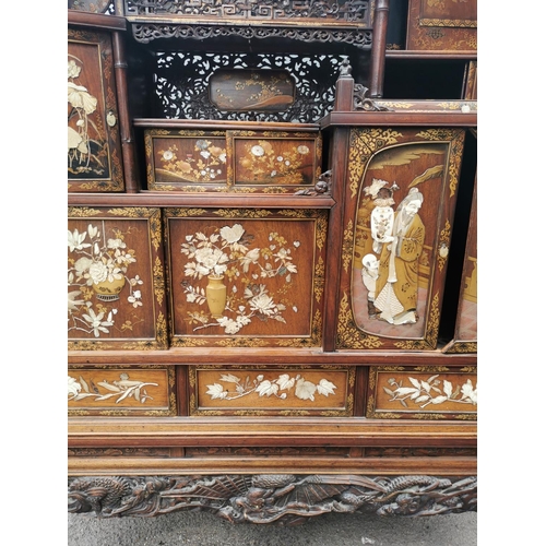 47 - A Japanese Meiji period Shibayama inlaid and lacquer display cabinet, with finely carved ivory, moth... 