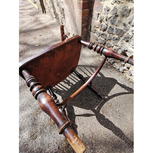 156 - A 19th century ash windsor chair with comb back, pierced splat, supported on turned legs with crinol... 